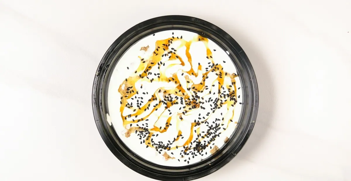 Yogurt finished with honey, sesame and black seed